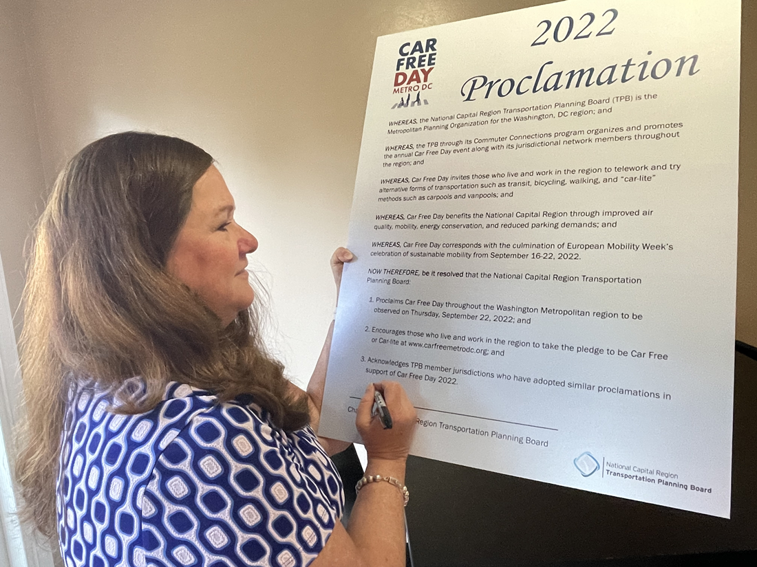 TPB Chair Pamela Sebesky signing 2022 Car Free Day Proclamation